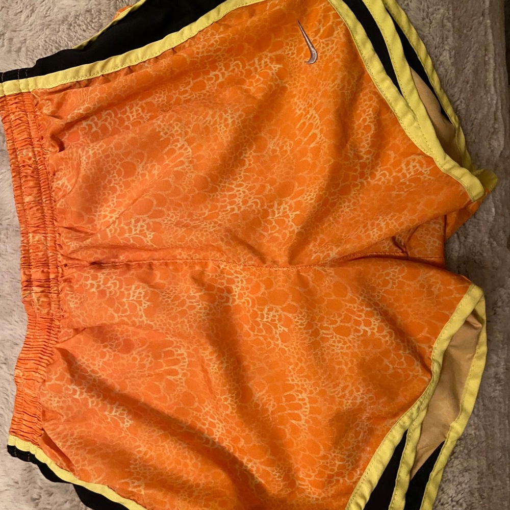 Orange Nike Dri-Fit shorts